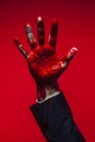 businessman hand with red paint, generative AI