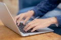 Closeup hand of businessman typing keyboard on laptop computer on desk at home. Royalty Free Stock Photo