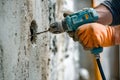Closeup of a hand drilling a hole in a wall by generative ai Royalty Free Stock Photo