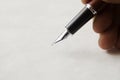 Closeup of hand with fountain pen Royalty Free Stock Photo