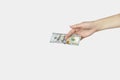 Closeup hand giving money isolated on white background. Money Financial and Payment Concept Royalty Free Stock Photo