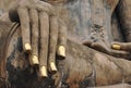 Hand of an ancient Buddha statue in Wat Mahathat temple. Golden nails. Thailand, Sukhothai, Royalty Free Stock Photo