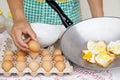 Closeup hand hold egg for cooking fried eggs menu. Royalty Free Stock Photo