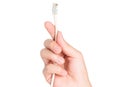closeup hand holding electrical plug and Lan cable Royalty Free Stock Photo