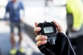 Closeup of hand holding stopwatch