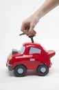 Closeup Of Hand Inserting Keys In Toy Car