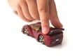 Hand of kid playng with miniature car Royalty Free Stock Photo