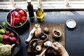Closeup of hand with knife cutting mushroom Royalty Free Stock Photo