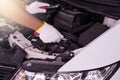 Closeup of hand mechanic engineer fixing car battery at garage