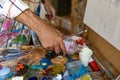 Closeup of hand mixing paint on palette at workshop Royalty Free Stock Photo