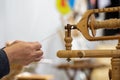 old woman using an old wool spinning wheel Royalty Free Stock Photo