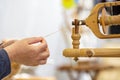 old woman using an old wool spinning wheel Royalty Free Stock Photo