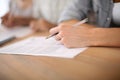 Closeup of hand with pen and application form Royalty Free Stock Photo