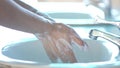 Closeup hand of person holding abundance wate with young plant in hand for agriculture or planting basil nature. save world concep