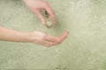 Closeup hand of a person holding bottle of cologne