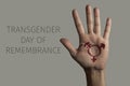 Hand and text transgender day of remembrance