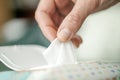 Closeup of Hand picked a wet wipes in package box, Wet wipes in a woman`s hand Royalty Free Stock Photo