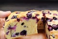 Closeup of Hand Picking a Slice of Blueberry Cake Royalty Free Stock Photo