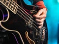 Closeup of a hand playing the bass guitar Royalty Free Stock Photo