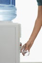 Closeup Of Hand Pouring Water From Cooler Royalty Free Stock Photo