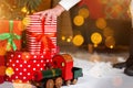 Santa Claus put presents box under the Christmas tree Royalty Free Stock Photo