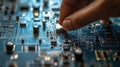 Closeup of Hand Selecting Electronics Device on Schematic Background: Precision and Technology in Focus