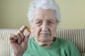 A senior woman holding a vitamin capsule Royalty Free Stock Photo