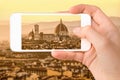 Closeup of a hand with smartphone taking a picture of Florence with the Basilica Santa Maria del Fiore Duomo, Tuscany Italy Royalty Free Stock Photo