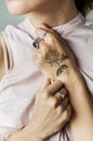 Closeup of hand tattoo of a woman