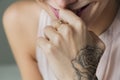 Closeup of hand tattoo of a woman