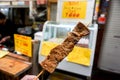 Barbecue Kobe beef wood stick on blurry barbecue Kobe beef shop Royalty Free Stock Photo