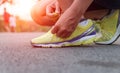 Closeup hand tying laces ready for run on road Royalty Free Stock Photo