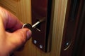 Closeup of a hand unlocking the door with the key Royalty Free Stock Photo