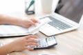 Closeup hand woman calculating expenses household and writing notebook on desk, girl checking bill and stress and note Royalty Free Stock Photo