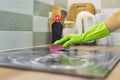 Closeup of hand woman cleaning modern cooking glass