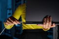 Closeup woman connecting internet network cable to laptop in server room Royalty Free Stock Photo