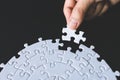 Closeup hand of woman connecting jigsaw puzzle, Business solutions, success and strategy concept Royalty Free Stock Photo