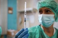 Closeup hand of woman doctor hold syringe with Pfizer`s coronavirus vaccine,