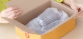 Closeup hand of woman opening parcel box with check product at home, female unpack with knife, delivery and shipping, shipment and