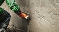 closeup hand worker plastering cement on wall for building house Royalty Free Stock Photo