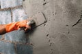 closeup hand worker plastering cement on wall for building house Royalty Free Stock Photo