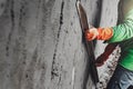 closeup hand worker plastering cement on wall for building house Royalty Free Stock Photo