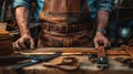 closeup hand working process leather handcraft in the leather workshop. Man holding crafting tool and working. He is