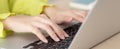 Closeup of hand young asian businesswoman working on laptop computer on desk at home office. Royalty Free Stock Photo