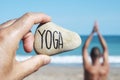 Yogi man and text yoga in a stone Royalty Free Stock Photo