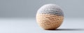 Closeup of a handcrafted sphere, meticulously crafted from twotoned yarn Royalty Free Stock Photo