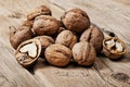 Closeup handful walnuts on the wooden surface