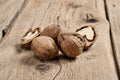 Closeup handful walnuts on the wooden table