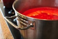 A closeup of the handle of a pot of tomato sauce Royalty Free Stock Photo