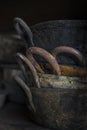 Closeup handles of old and rusty sauce pans